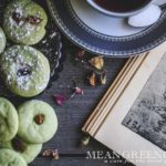 Overhead photo of green Pistachio Pudding Cookies on gray wooden background.