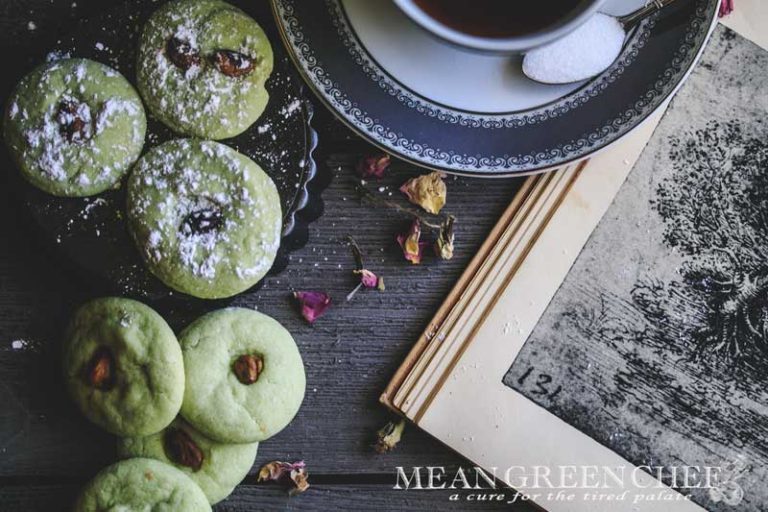 Overhead photo of green Pistachio Pudding Cookies on gray wooden background.