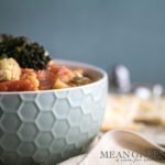 Side photo of a honeycomb pattern blue bowl filled with Hearty Vegetable Soup, Mean Green Chef.