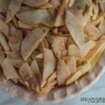 Slices of apples coated with apple pie spice for Caramel Apple Pie. Mean Green Chef