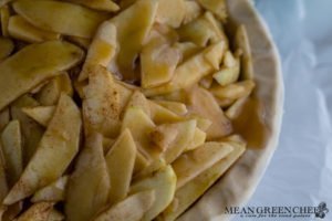 Caramel Apple Pie filled with apple slices and caramel sauce ready for lattice work. Mean Green Chef