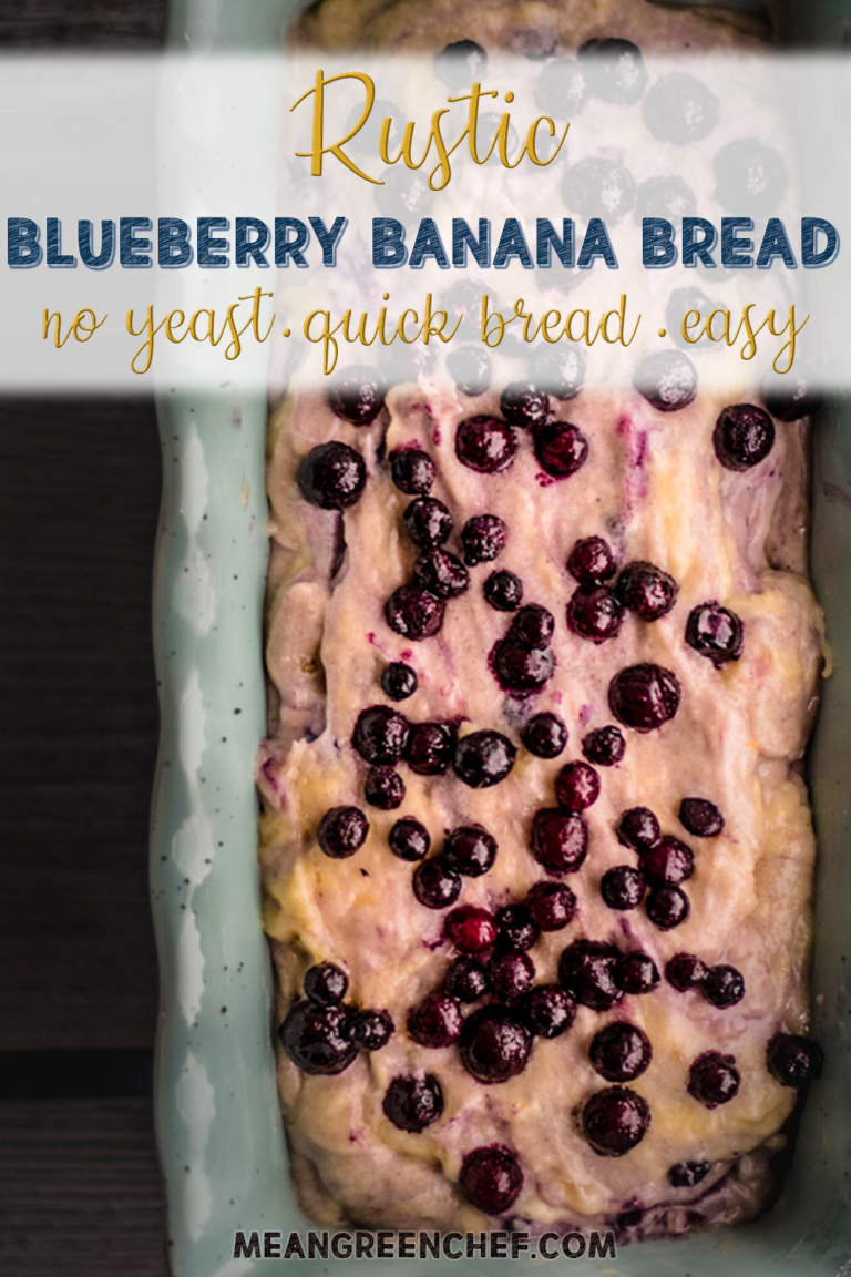 batter for easy blueberry banana bread in a blue loaf pan.