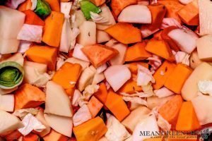 Ingredients cooking in a large stock pot on the stove top for Dutch Stamppot. Mean Green Chef