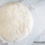 Soft pretzel dough in a disk ready to be rolled out