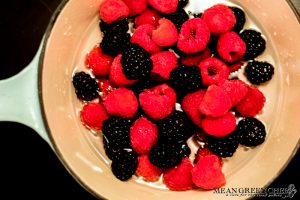 Raspberries and Blackberries taking a dip in a sugar water bath for sugared fruit.