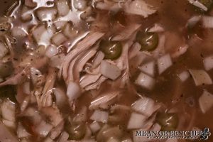 Mexican Tortilla Chicken Soup cooking in a large gray Dutch Oven.