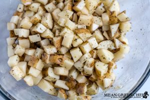 Overhead shot of potatoes about to be roasted in the oven for Restaurant Style Corned Beef Hash.