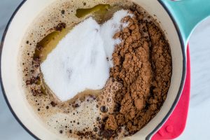 Ingredients for making Chocolate Guinness Cake being blended in a blue pot.