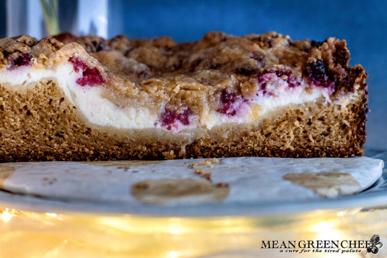 Side photo of Raspberry Coffee Cake showing layers of cheese and raspberries.