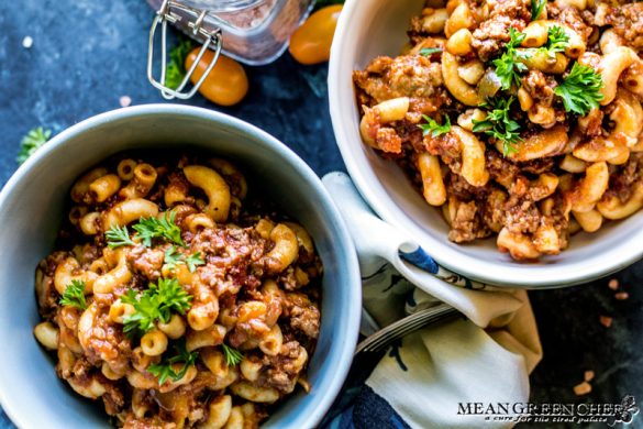 American Chop Suey in 2 bowls garnished with curly parsley.