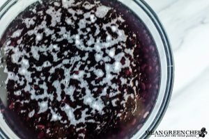 Black beans soaking in a large glass bowl for black bean soup.