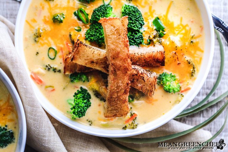 Bistro Broccoli Cheese Soup in large white bowls garnished with grilled sourdough bread.