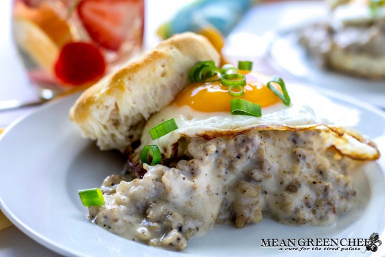 Country Sausage Gravy, served over fluffy buttermilk biscuits and topped with a bright sunny side up egg.