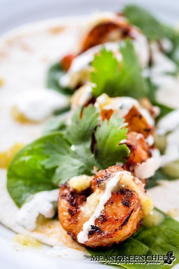 Close up of Blackened Shrimp on a soft tortilla.