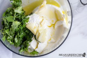 Ingredients for Cilantro Garlic Sauce in food processor ready to be blitzed.