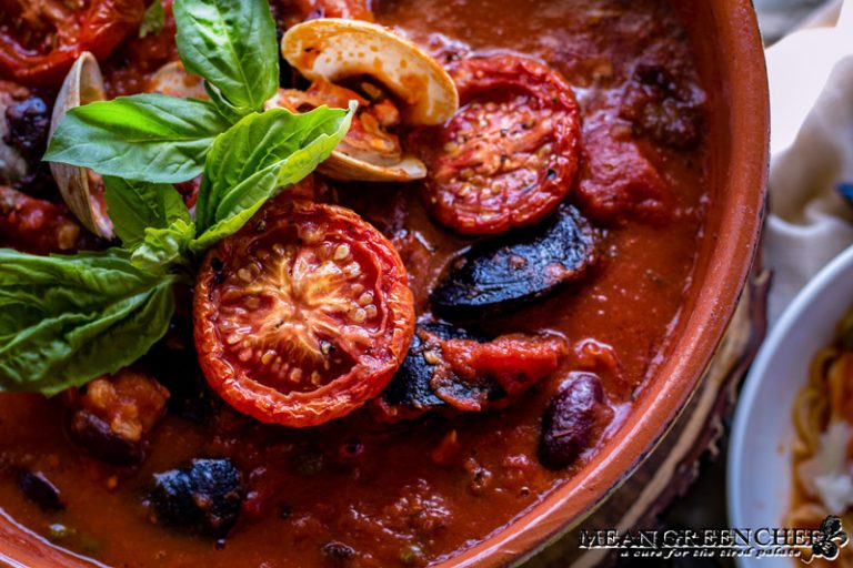 Pasta Pescatore in a large clay pot with mussels, clams and shrimp.