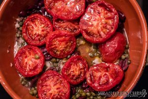 Whole Sweet slow roasted tomatoes added to Pescatore Sauce in the making.