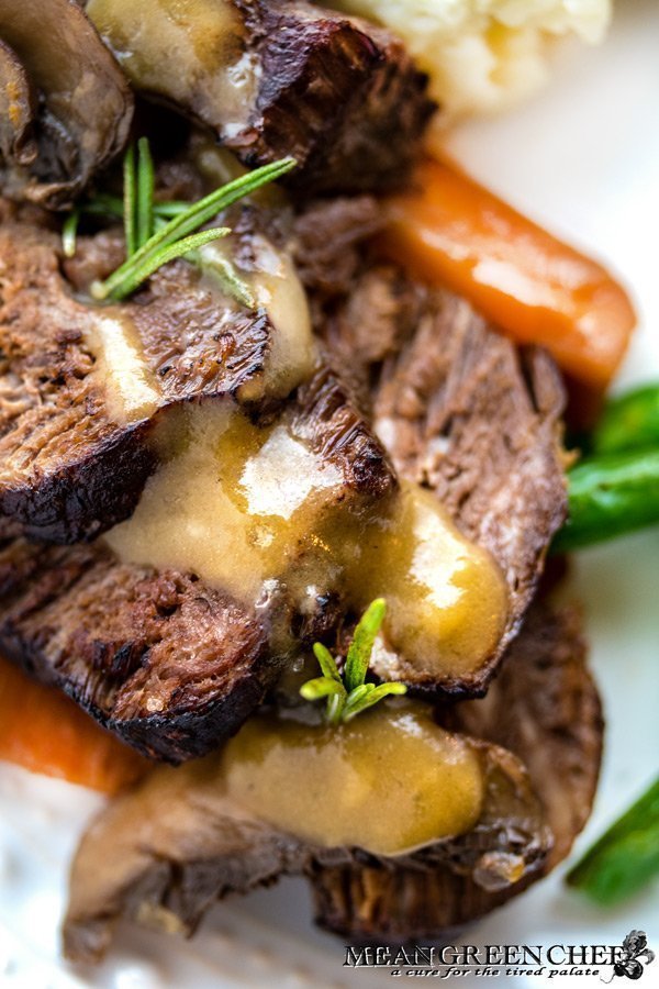 Plate of Red Wine Pot Roast made in the Instant Pot and served with mashed potatoes and sauteed green beans.