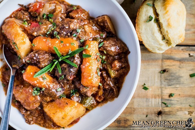 Bowl of Old Fashioned Beef Stew with biscuits.