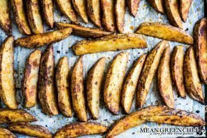 Crispy oven baked fries on a sheet pan just after baking.