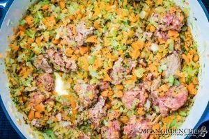 Sausage being added to Pasta e Fagioli.