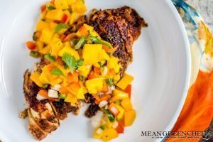 Blackened Chicken with fresh mango salsa in a white bowl.