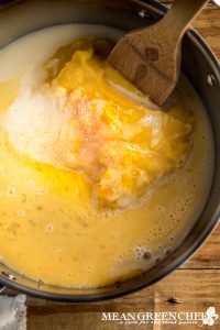 Condensed milk being added to pumpkin puree and other ingredients for Punch of Pumpkin Pie