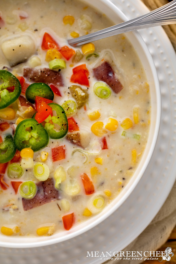 Sweet Corn Chowder in a classic white bowl on a wooden background