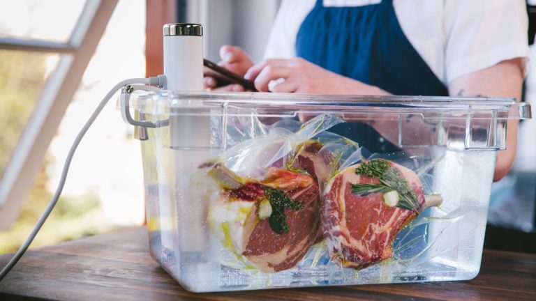 Steaks being cooked with rosemary via Sous Vide