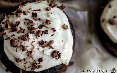 Overhead photo of Guinness Chocolate Cake with chocolate shavings sitting on parchment paper.