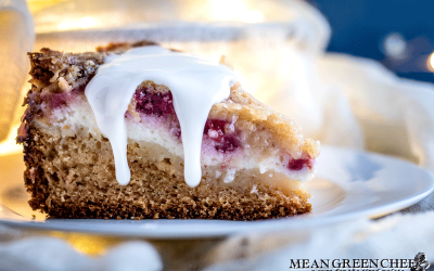 Side photo of Raspberry Coffee Cake with thick dripping vanilla glaze.