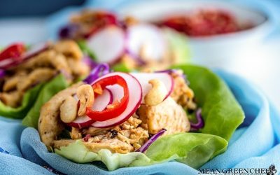 Thai Chicken Lettuce Wraps on a white background with Prik nam pla.